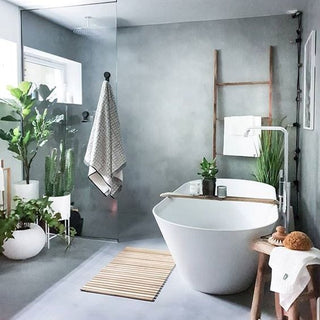 Great bathroom, with green plants via DreamDecor.com
